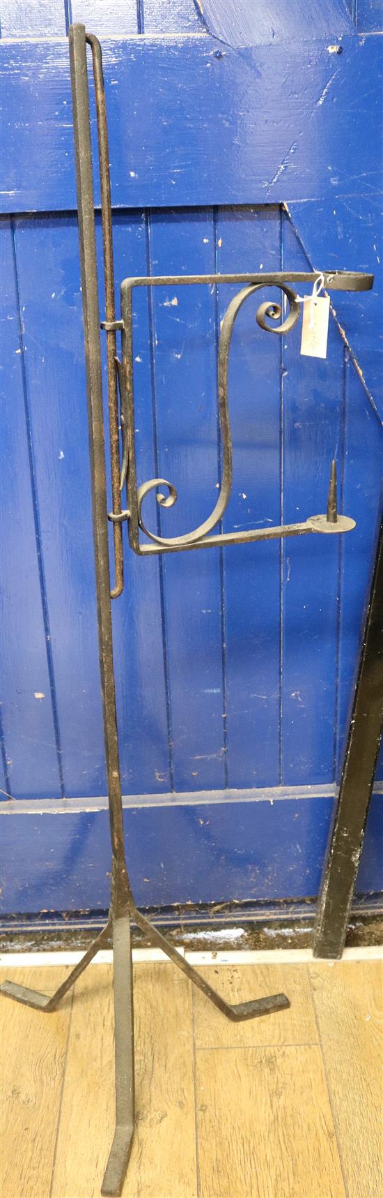 A wrought iron pricket candle stand, H.136cm